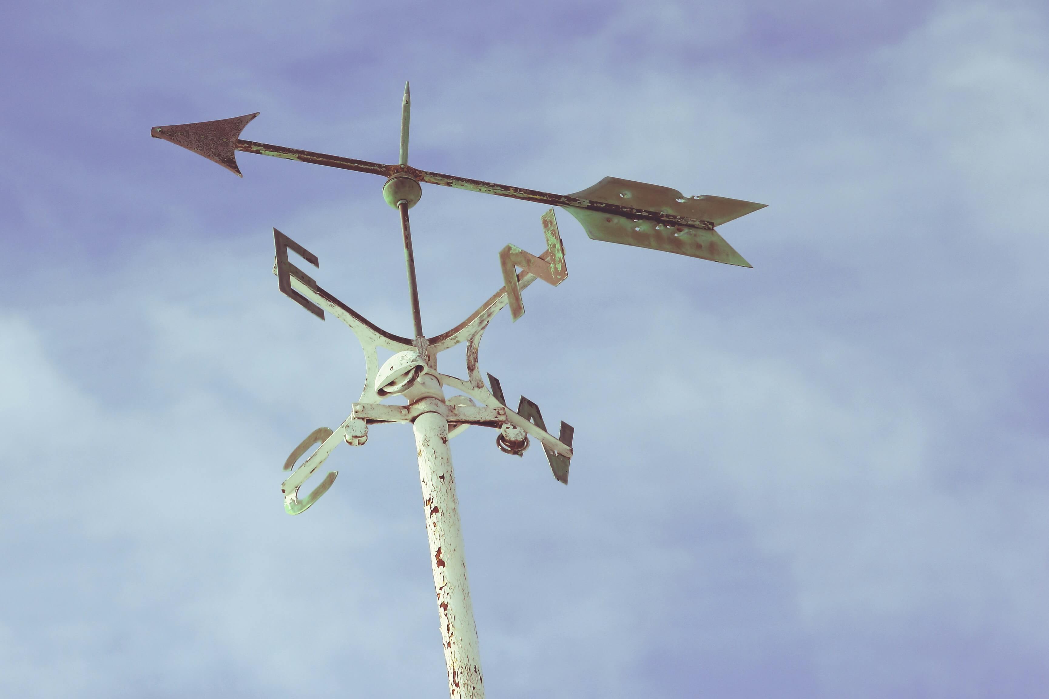 a wind vane showing the wind direction is east