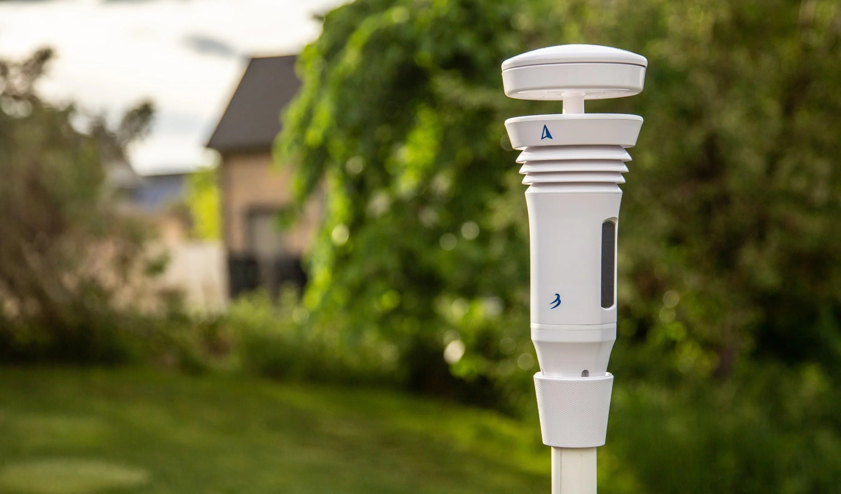 tempest weather system mounted in a front yard